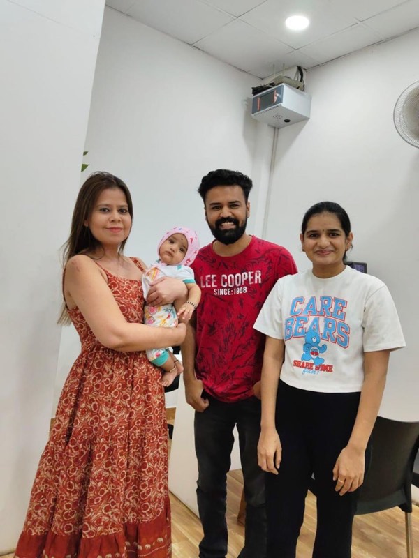 Dr. Payal Aggarwal with a family and baby at She Health Clinic