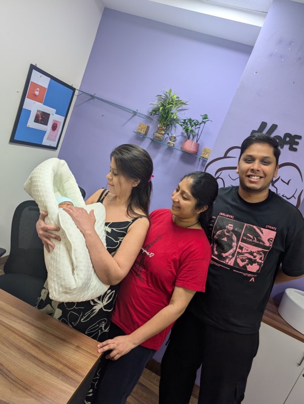 Dr. Payal Aggarwal welcoming a family and their newborn at She Health Clinic