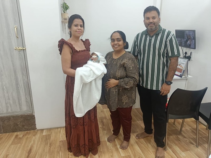 Dr. Payal Aggarwal with a family and their newborn during a clinic visit